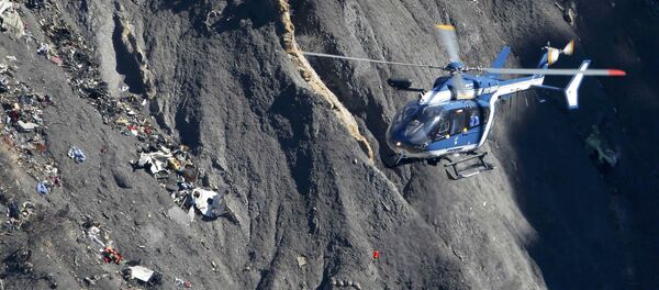 A French Gendarmerie rescue helicopter flies over the debris of the Germanwings Airbus A320 at the site of the crash, near Seyne-les-Alpes, France, in this picture taken on March 27, 2015. French BEA air accident investigators reported March 13, 2016 that a doctor had recommended that the German pilot who crashed a Germanwings jet into the Alps last year should be treated in a psychiatric hospital two weeks before the disaster A French Gendarmerie rescue helicopter flies over the debris of the Germanwings Airbus A320 at the site of the crash, near Seyne-les-Alpes, France, in this picture taken on March 27, 2015. French BEA air accident investigators reported March 13, 2016 that a doctor had recommended that the German pilot who crashed a Germanwings jet into the Alps last year should be treated in a psychiatric hospital two weeks before the disaster - Sputnik International