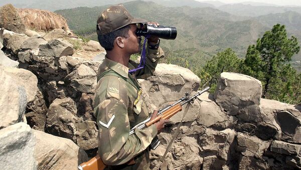 An Indian soldier looks through binoculars at a forward post somewhere in Mendhar sector 200 meters from the Line of Control separating Indian and Pakistan held Kashmir, some 100 Kms southwest of Srinagar (File) - Sputnik International