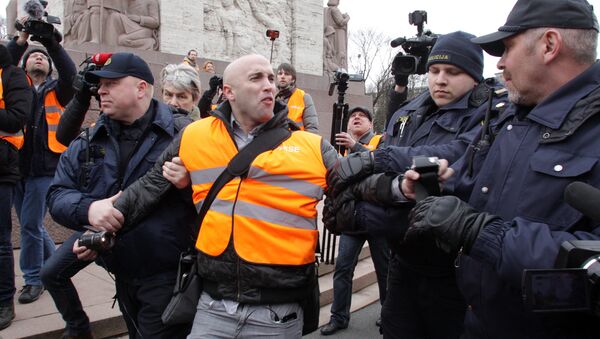 The arrest of journalist Graham Phillips at SS veterans' march in Riga, Latvia. March 16, 2016 - Sputnik International