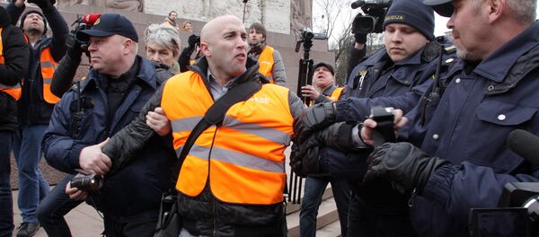 The arrest of journalist Graham Phillips at SS veterans' march in Riga, Latvia. March 16, 2016 - Sputnik International