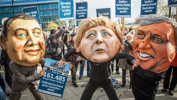 Protesters wearing masks of Sigmar Gabriel, Angela Merkel and Horst Seehofer. - Sputnik International