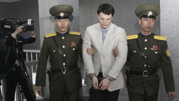 American student Otto Warmbier, center, is escorted at the Supreme Court in Pyongyang. - Sputnik International