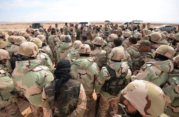 Fighters of the Desert Falcons self-defense unit during re-stationing of troops near the Syrian city of Palmyra. Fighters of the Desert Falcons self-defense unit during re-stationing of troops near the Syrian city of Palmyra. - Sputnik International