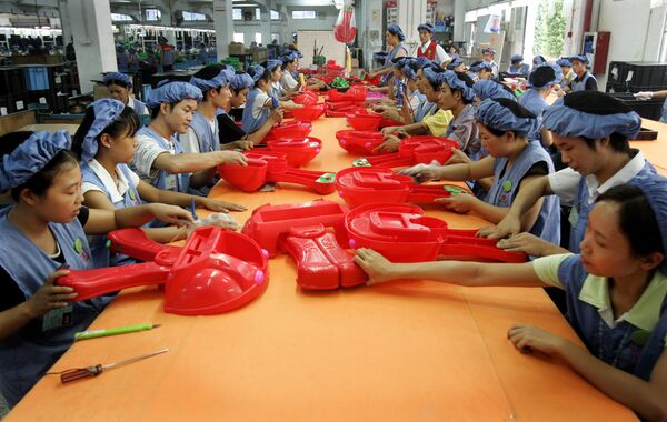 Workers assemble toy cars at the production line of Dongguan Da Lang Wealthwise Plastic Factory in Dongguan, China. (File) Workers assemble toy cars at the production line of Dongguan Da Lang Wealthwise Plastic Factory in Dongguan, China. (File) - Sputnik International