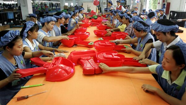 Workers assemble toy cars at the production line of Dongguan Da Lang Wealthwise Plastic Factory in Dongguan, China. (File) - Sputnik International