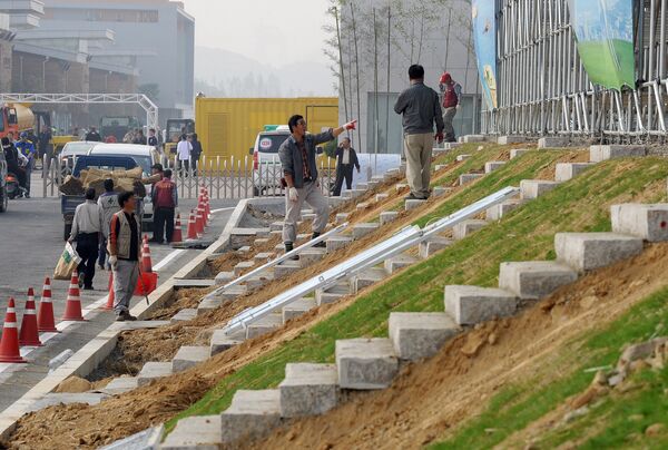 South Korean workers build stairs near the main grand stand at the Korean International Circuit under construction ahead Formula One's Korean Grand Prix in Yeongam, 320 km south of Seoul. (File) South Korean workers build stairs near the main grand stand at the Korean International Circuit under construction ahead Formula One's Korean Grand Prix in Yeongam, 320 km south of Seoul. (File) - Sputnik International