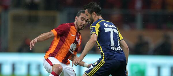 Galatasaray's Tarik Camdal, left, and Gokhan Gonul of Fenerbahce fight for the ball during their Turkish League soccer derby match at the TT Arena stadium in Istanbul, Turkey. (File) Galatasaray's Tarik Camdal, left, and Gokhan Gonul of Fenerbahce fight for the ball during their Turkish League soccer derby match at the TT Arena stadium in Istanbul, Turkey. (File) - Sputnik International
