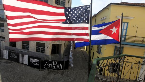 US and Cuban flags are seen on the balcony of a restaurant in downtown Havana, Cuba March 19, 2016. - Sputnik International