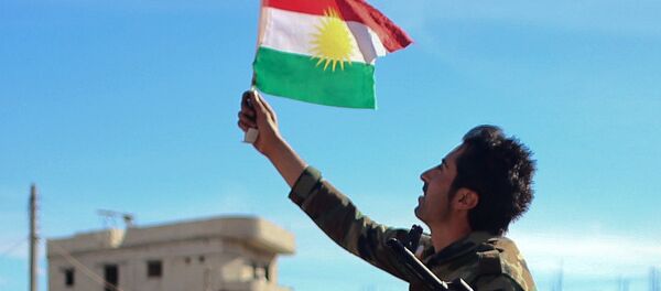 Kurdish Peshmerga fighters pose for a picture during a break in fighting against Islamic State (IS) group on November 8, 2014 in the Syrian besieged border town of Ain al-Arab (known as Kobane by the Kurds) - Sputnik International