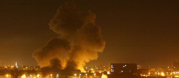 Fire and smoke can be seen over Baghdad Thursday night, March 27, 2003 - Sputnik International
