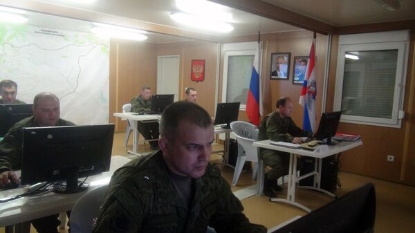Russian soldiers work behind their screens on March 17, 2016 in Russia's reconciliation center as they monitor the truce in Syria at the Hmeimim air base in the Latakia province Russian soldiers work behind their screens on March 17, 2016 in Russia's reconciliation center as they monitor the truce in Syria at the Hmeimim air base in the Latakia province - Sputnik International