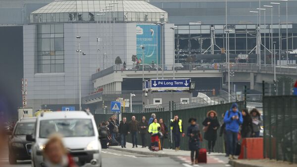 People leave the scene of explosions at Zaventem airport near Brussels, Belgium, March 22, 2016 - Sputnik International