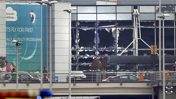 Broken windows seen at the scene of explosions at Zaventem airport near Brussels, Belgium, March 22, 2016 - Sputnik International