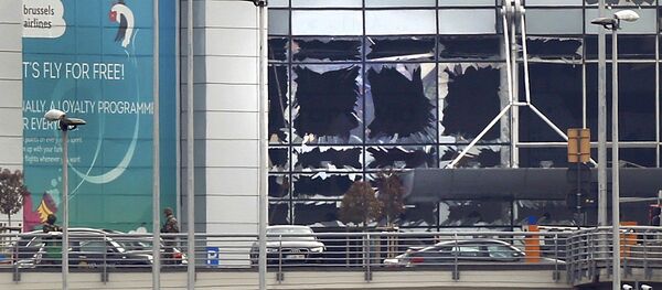 Broken windows seen at the scene of explosions at Zaventem airport near Brussels, Belgium, March 22, 2016 - Sputnik International