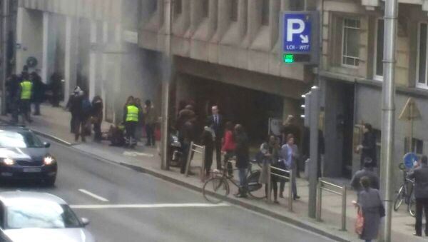 A picture taken on March 22, 2016 shows smoke rising from the Maalbeek underground, in Brussels, following a blast at the station close to the capital's European quarter. The Brussels metro service was being shut down on March 22, its operator said - Sputnik International