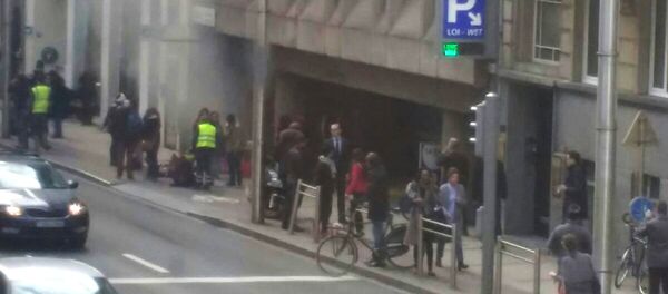 A picture taken on March 22, 2016 shows smoke rising from the Maalbeek underground, in Brussels, following a blast at the station close to the capital's European quarter. The Brussels metro service was being shut down on March 22, its operator said A picture taken on March 22, 2016 shows smoke rising from the Maalbeek underground, in Brussels, following a blast at the station close to the capital's European quarter. The Brussels metro service was being shut down on March 22, its operator said - Sputnik International