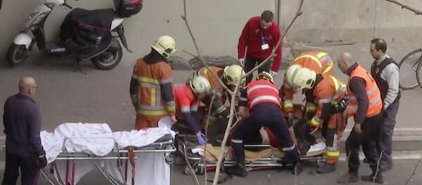 In this image made from video, emergency rescue workers stretcher an unidentified person at the site of an explosion at a metro station in Brussels, Belgium, March 22, 2016 In this image made from video, emergency rescue workers stretcher an unidentified person at the site of an explosion at a metro station in Brussels, Belgium, March 22, 2016 - Sputnik International