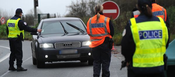 French border and customs police control vehicles at the France-Belgium border. File photo - Sputnik International
