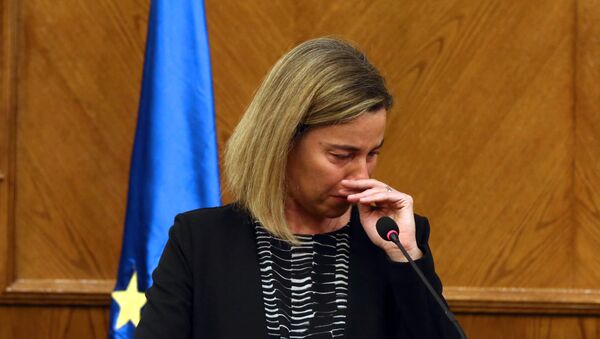 EU foreign policy chief Federica Mogherini reacts during a joint press conference with Jordanian Foreign Minister in the capital Amman, on March 22, 2016, upon receiving the news about a string of explosions that rocked Brussels airport and a city metro station - Sputnik International