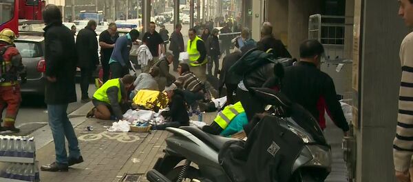Rescue workers treat victims outside the Maelbeek metro station after a blast, in Brussels, Belgium, in this image taken from a March 22, 2016 video Rescue workers treat victims outside the Maelbeek metro station after a blast, in Brussels, Belgium, in this image taken from a March 22, 2016 video - Sputnik International