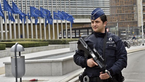 Police patrol the EU commission building, after a bomb exploded nearby, at the subway in Brussels, Belgium, Tuesday, March 22, 2016 - Sputnik International