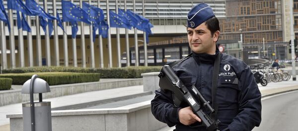 Police patrol the EU commission building, after a bomb exploded nearby, at the subway in Brussels, Belgium, Tuesday, March 22, 2016 - Sputnik International