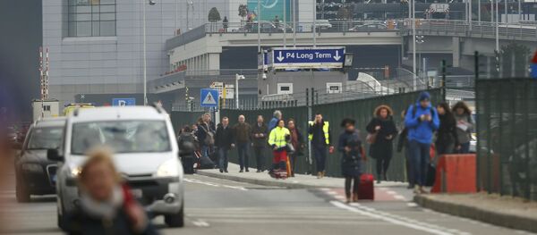 People leave the scene of explosions at Zaventem airport near Brussels, Belgium, March 22, 2016. People leave the scene of explosions at Zaventem airport near Brussels, Belgium, March 22, 2016. - Sputnik International