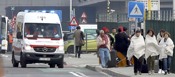 People wrapped in blankets leave the scene of explosions at Zaventem airport near Brussels, Belgium, March 22, 2016 People wrapped in blankets leave the scene of explosions at Zaventem airport near Brussels, Belgium, March 22, 2016 - Sputnik International