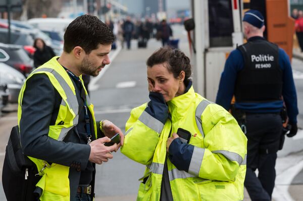 People react outside Brussels airport after explosions rocked the facility in Brussels, Belgium Tuesday March 22, 2016 People react outside Brussels airport after explosions rocked the facility in Brussels, Belgium Tuesday March 22, 2016 - Sputnik International