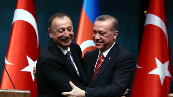 Azerbaijani President Ilham Aliyev (L) and Turkish President Recep Tayyip Erdogan (R) huging after signing bilateral agreements following the 5th Turkey-Azerbaijan High Level Strategic Cooperation Council meeting at the Presidential Complex in Ankara - Sputnik International