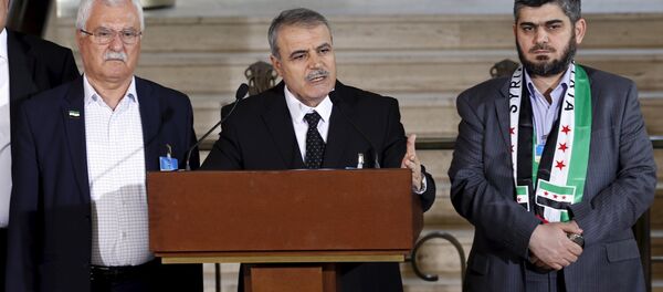 Asaad Al-Zoubi attends a news conference next to Mohamed Alloush of the Jaysh al Islam and George Sabra members of the High Negotiations Committee (HNC) after a meeeting with U.N. mediator Staffan de Mistura during Syria peace talks at the United Nations in Geneva, Switzerland, March 22, 2016 Asaad Al-Zoubi attends a news conference next to Mohamed Alloush of the Jaysh al Islam and George Sabra members of the High Negotiations Committee (HNC) after a meeeting with U.N. mediator Staffan de Mistura during Syria peace talks at the United Nations in Geneva, Switzerland, March 22, 2016 - Sputnik International