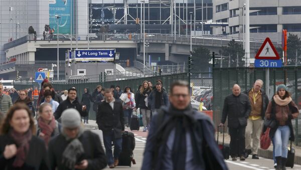 People leave the scene of explosions at Zaventem airport near Brussels, Belgium, March 22, 2016 - Sputnik International