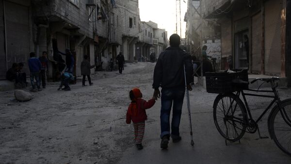 An injured Syrian man walks holding his daughter's hand in Barza, a northern suburb of the capital Damascus, on March 22, 2016 - Sputnik International