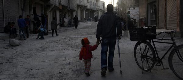 An injured Syrian man walks holding his daughter's hand in Barza, a northern suburb of the capital Damascus, on March 22, 2016 An injured Syrian man walks holding his daughter's hand in Barza, a northern suburb of the capital Damascus, on March 22, 2016 - Sputnik International