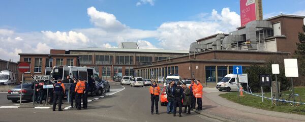 Police set up a security cordon around the Brussels Airport after two explosions ripped through the building on March 22 Police set up a security cordon around the Brussels Airport after two explosions ripped through the building on March 22 - Sputnik International