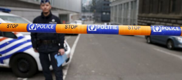 A Belgian police officer stands guard near the federal police headquarters in Brussels, March 19, 2016, after Salah Abdeslam, the most-wanted fugitive from November's Paris attacks, was arrested after a shootout with police in Brussels on Friday. A Belgian police officer stands guard near the federal police headquarters in Brussels, March 19, 2016, after Salah Abdeslam, the most-wanted fugitive from November's Paris attacks, was arrested after a shootout with police in Brussels on Friday. - Sputnik International