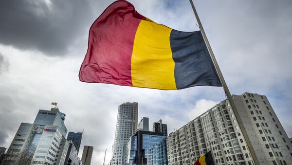 The Belgian flag flying at half-mast is pictured at the Hofplein in Rotterdam, on March 23, 2016. - Sputnik International