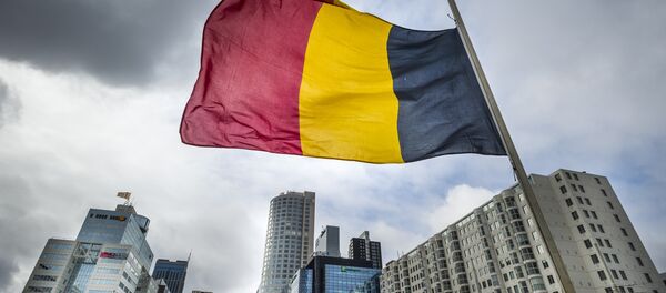 The Belgian flag flying at half-mast is pictured at the Hofplein in Rotterdam, on March 23, 2016. - Sputnik International
