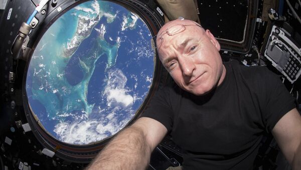 NASA astronaut Scott Kelly is seen inside the cupola of the International Space Station, a special module that provides a 360-degree viewing of the Earth and the station in this undated photo released on March 11, 2016 - Sputnik International