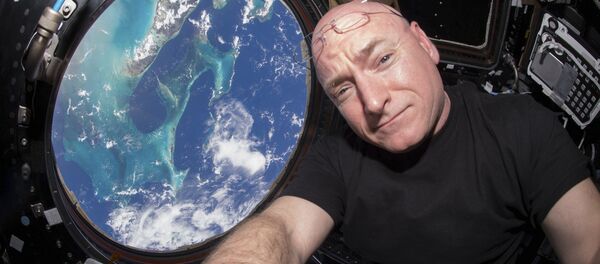 NASA astronaut Scott Kelly is seen inside the cupola of the International Space Station, a special module that provides a 360-degree viewing of the Earth and the station in this undated photo released on March 11, 2016 - Sputnik International