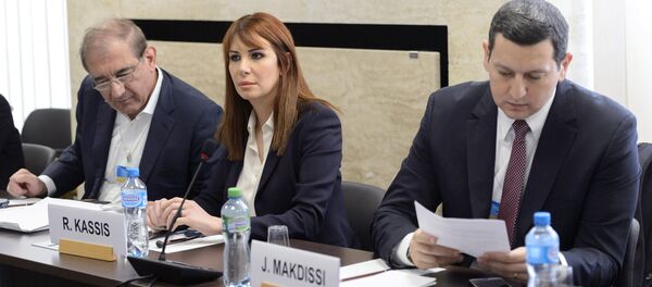 Syria's former deputy Prime Minister Qadri Jamil (L), Randa Kassis (C) and Jihad Makdissi, members of Syria's opposition react before a round of negotiations between Syria's opposition and the U.N., at the European headquarters of the United Nations in Geneva, Switzerland, March 23, 2016 Syria's former deputy Prime Minister Qadri Jamil (L), Randa Kassis (C) and Jihad Makdissi, members of Syria's opposition react before a round of negotiations between Syria's opposition and the U.N., at the European headquarters of the United Nations in Geneva, Switzerland, March 23, 2016 - Sputnik International