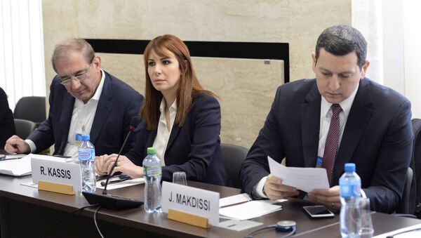Syria's former deputy Prime Minister Qadri Jamil (L), Randa Kassis (C) and Jihad Makdissi, members of Syria's opposition react before a round of negotiations between Syria's opposition and the U.N., at the European headquarters of the United Nations in Geneva, Switzerland, March 23, 2016 - Sputnik International