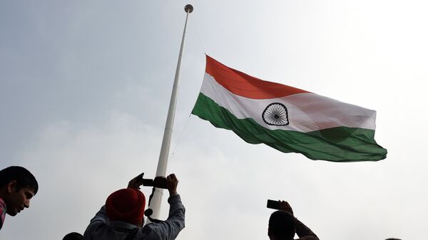 Indian residents photograph India's tallest flag as it is unveiled in Faridabad on the outskirts of New Delhi on March 3, 2015 - Sputnik International