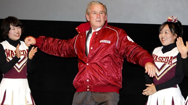 Former U.S. President George W. Bush, center, shows a pitching form, wearing a university's baseball jacket, during his visit to Waseda University in Tokyo, Japan. - Sputnik International