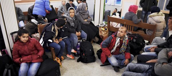 Iraqi refugees wait for a train to Helsinki at Kemi railway station in northwestern Finland Iraqi refugees wait for a train to Helsinki at Kemi railway station in northwestern Finland - Sputnik International