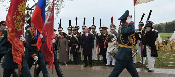 Russian President Vladimir Putin, background center, watching the march of the company of honor guards during celebrations of the 200th anniversary of the Battle of Borodino at the State Borodino Military and Historical Museum-Reserve, September 2, 2012. Russian President Vladimir Putin, background center, watching the march of the company of honor guards during celebrations of the 200th anniversary of the Battle of Borodino at the State Borodino Military and Historical Museum-Reserve, September 2, 2012. - Sputnik International