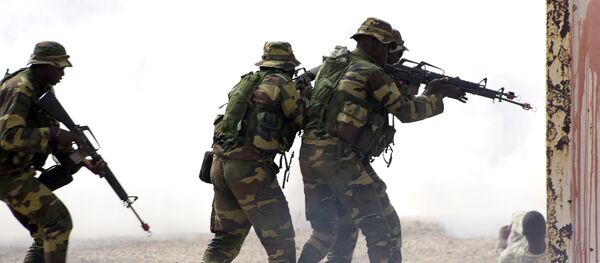 Senegalese soldiers take part on a large annual military exercise, known as Flintlock, on February 24, 2016, in Thies. The exercise has been bringing together African, European and US counter-terrorism forces every year for the past decade Senegalese soldiers take part on a large annual military exercise, known as Flintlock, on February 24, 2016, in Thies. The exercise has been bringing together African, European and US counter-terrorism forces every year for the past decade - Sputnik International