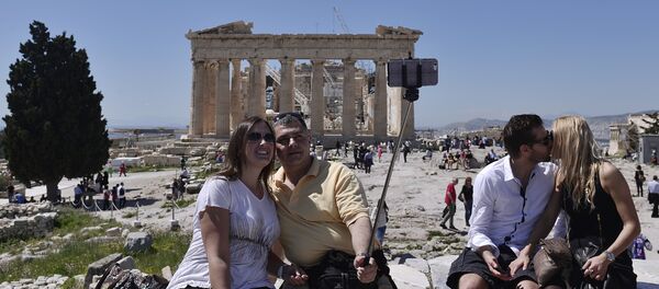 Tourists take pictures while visiting the Acropolis in Athens on April 3, 2015 Tourists take pictures while visiting the Acropolis in Athens on April 3, 2015 - Sputnik International