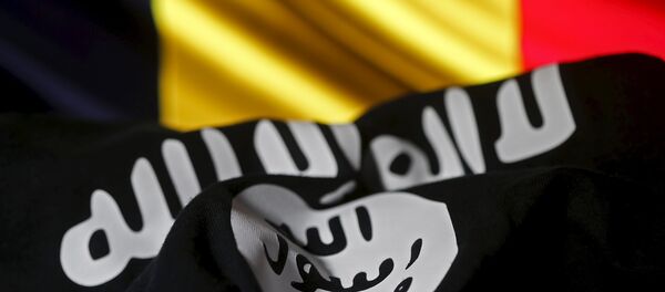Islamic State flag is seen in front of a Belgian flag in this illustration taken March 22, 2016 Islamic State flag is seen in front of a Belgian flag in this illustration taken March 22, 2016 - Sputnik International