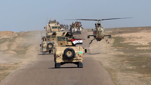In this Wednesday, March 9, 2016 photo, Iraqi Defense Minister Khaled al-Obeidi's convoy tours the front line in their fight against Islamic State group militants in the Samarra desert, on the border between Anbar and Salahuddin provinces, Iraq - Sputnik International